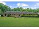 Brick home features a vast backyard and patio, offering ample space for outdoor enjoyment at 1541 Eldonlas Ct, Stone Mountain, GA 30087