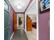 View of the foyer with stone tile flooring and colorful walls at 1541 Eldonlas Ct, Stone Mountain, GA 30087