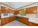 Updated kitchen with wood cabinets and modern appliances at 1541 Eldonlas Ct, Stone Mountain, GA 30087