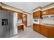 Kitchen featuring stainless steel refrigerator and built-in oven at 1541 Eldonlas Ct, Stone Mountain, GA 30087