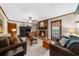 Living room with a brick fireplace and comfortable seating at 1541 Eldonlas Ct, Stone Mountain, GA 30087