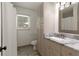 Bathroom with gray vanity, marble countertop, shower, and plenty of storage space at 340 Monivea Ln, Roswell, GA 30075