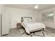 Bright bedroom featuring a comfortable bed, a window for natural light, and stylish decor at 340 Monivea Ln, Roswell, GA 30075