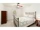 Inviting bedroom with a wrought-iron bed frame, dresser and natural light at 340 Monivea Ln, Roswell, GA 30075