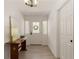Bright entryway features a white front door with sidelights, light wood flooring, and decorative accents at 340 Monivea Ln, Roswell, GA 30075