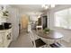 Open kitchen layout boasts modern grey cabinetry, stainless steel appliances, and a charming breakfast nook at 340 Monivea Ln, Roswell, GA 30075