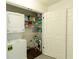 A well organized Laundry Room and Pantry with stacked Washer and Dryer at 340 Monivea Ln, Roswell, GA 30075