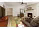 Cozy living room with a fireplace, comfortable seating, and open access to other areas of the home at 340 Monivea Ln, Roswell, GA 30075