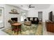 Inviting living room with a fireplace, comfortable seating, and sliding doors to the backyard at 340 Monivea Ln, Roswell, GA 30075