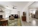 Cozy living room featuring a fireplace, comfortable seating, and an open view to the kitchen area at 340 Monivea Ln, Roswell, GA 30075
