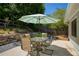 Patio view with an outdoor table and chairs under a shade umbrella at 340 Monivea Ln, Roswell, GA 30075