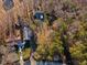 Aerial view of homes surrounded by trees, showcasing the peaceful neighborhood at 7427 Hollis Rd, Douglasville, GA 30135