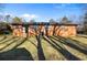Large backyard with expansive lawn and mature trees offers plenty of outdoor space at 7427 Hollis Rd, Douglasville, GA 30135