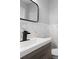 Bathroom with modern vanity and black fixtures offers bright and stylish design at 7427 Hollis Rd, Douglasville, GA 30135