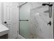 Bathroom with tiled shower and modern fixtures offers bright and stylish design at 7427 Hollis Rd, Douglasville, GA 30135