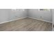 Bedroom with wood floors, gray walls, and white trim provides a calm and soothing space at 7427 Hollis Rd, Douglasville, GA 30135