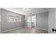 Bedroom with wood floors, gray walls, and lots of natural light provides a calm and relaxing space at 7427 Hollis Rd, Douglasville, GA 30135