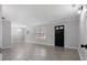 Bright living room features gray walls, chandelier, fresh paint, new floors, and natural light at 7427 Hollis Rd, Douglasville, GA 30135