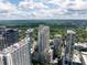 Stunning aerial view showcases luxury high-rise buildings with rooftop pools overlooking a lush green landscape at 855 Peachtree Ne St # 2203, Atlanta, GA 30308