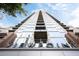 Striking upward view of the building showcasing its modern architecture and impressive height at 855 Peachtree Ne St # 2203, Atlanta, GA 30308