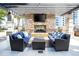 Outdoor lounge area featuring comfortable seating, a fireplace, and city views at 855 Peachtree Ne St # 2203, Atlanta, GA 30308