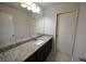 Bathroom featuring a granite vanity with a sink and a large mirror at 2289 Overlook Ave, Lithonia, GA 30058
