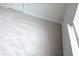Corner bedroom showcases a window and neutral carpet with white trim at 2289 Overlook Ave, Lithonia, GA 30058