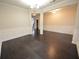 Spacious dining area featuring hardwood floors, classic wainscoting, and neutral paint tones at 2289 Overlook Ave, Lithonia, GA 30058