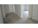 Hallway featuring neutral carpeting and multiple doorways to bedrooms or other rooms at 2289 Overlook Ave, Lithonia, GA 30058
