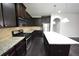 Bright kitchen with granite countertops, stainless appliances, and a convenient island at 2289 Overlook Ave, Lithonia, GA 30058