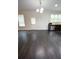 An open-concept living area is showcased with hardwood floors and a view of the kitchen at 2289 Overlook Ave, Lithonia, GA 30058