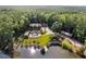 Stunning aerial view of lakefront home featuring a private pool, expansive yard, and dock at 4095 E Highway 166 Hwy, Carrollton, GA 30116