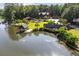 Picturesque aerial view of a waterfront estate with a private dock and sprawling, lush greenery at 4095 E Highway 166 Hwy, Carrollton, GA 30116