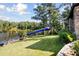 This private backyard boasts a large slide and a lake view at 4095 E Highway 166 Hwy, Carrollton, GA 30116