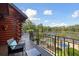 Scenic balcony view of lake, pool and trees from an elevated log home at 4095 E Highway 166 Hwy, Carrollton, GA 30116