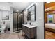 Modern bathroom featuring a glass shower and vanity with a white sink at 4095 E Highway 166 Hwy, Carrollton, GA 30116