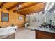 Bathroom with a soaking tub, walk-in shower, and wooden walls and ceilings at 4095 E Highway 166 Hwy, Carrollton, GA 30116