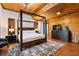 Primary bedroom with dark wood floors, canopy bed and modern furnishings at 4095 E Highway 166 Hwy, Carrollton, GA 30116