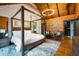 Bedroom showcasing a luxurious four poster bed and stylish decor at 4095 E Highway 166 Hwy, Carrollton, GA 30116