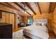 Cozy bedroom featuring a queen sized bed, wood paneled walls and a window at 4095 E Highway 166 Hwy, Carrollton, GA 30116
