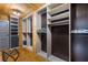 Spacious wooden closet with shelving and cabinets offering ample storage at 4095 E Highway 166 Hwy, Carrollton, GA 30116