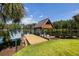 Lakefront dock with a covered boat lift provides direct access to the water and recreational activities at 4095 E Highway 166 Hwy, Carrollton, GA 30116