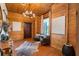 Welcoming entryway with wood paneled walls, modern light fixtures, and decor at 4095 E Highway 166 Hwy, Carrollton, GA 30116