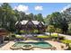 Beautiful exterior of a log cabin style home with a pool and a stone patio at 4095 E Highway 166 Hwy, Carrollton, GA 30116