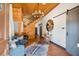 Inviting foyer with wood accents, stylish light fixture and cowhide rug on tile floors at 4095 E Highway 166 Hwy, Carrollton, GA 30116