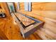 Recreational room featuring a wooden shuffleboard table and wood paneled walls at 4095 E Highway 166 Hwy, Carrollton, GA 30116