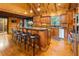 A spacious kitchen offers wooden cabinets, stainless steel appliances, and lots of counter space perfect for Gathering gatherings at 4095 E Highway 166 Hwy, Carrollton, GA 30116