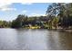 Expansive lake view highlighting the waterfront property with a boat dock and lush surroundings at 4095 E Highway 166 Hwy, Carrollton, GA 30116