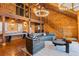 Cozy living room with open floor plan, staircase, stylish furniture, and wood-paneled walls at 4095 E Highway 166 Hwy, Carrollton, GA 30116