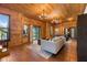 Bright living room with wood paneled walls, modern furnishings, and an abundance of natural light at 4095 E Highway 166 Hwy, Carrollton, GA 30116